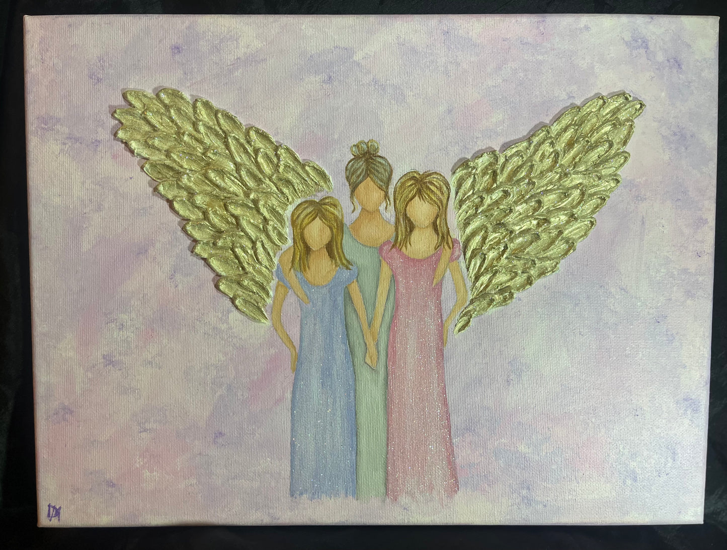 Angel protecting 2 girls/women with large gold wings on a textured background
